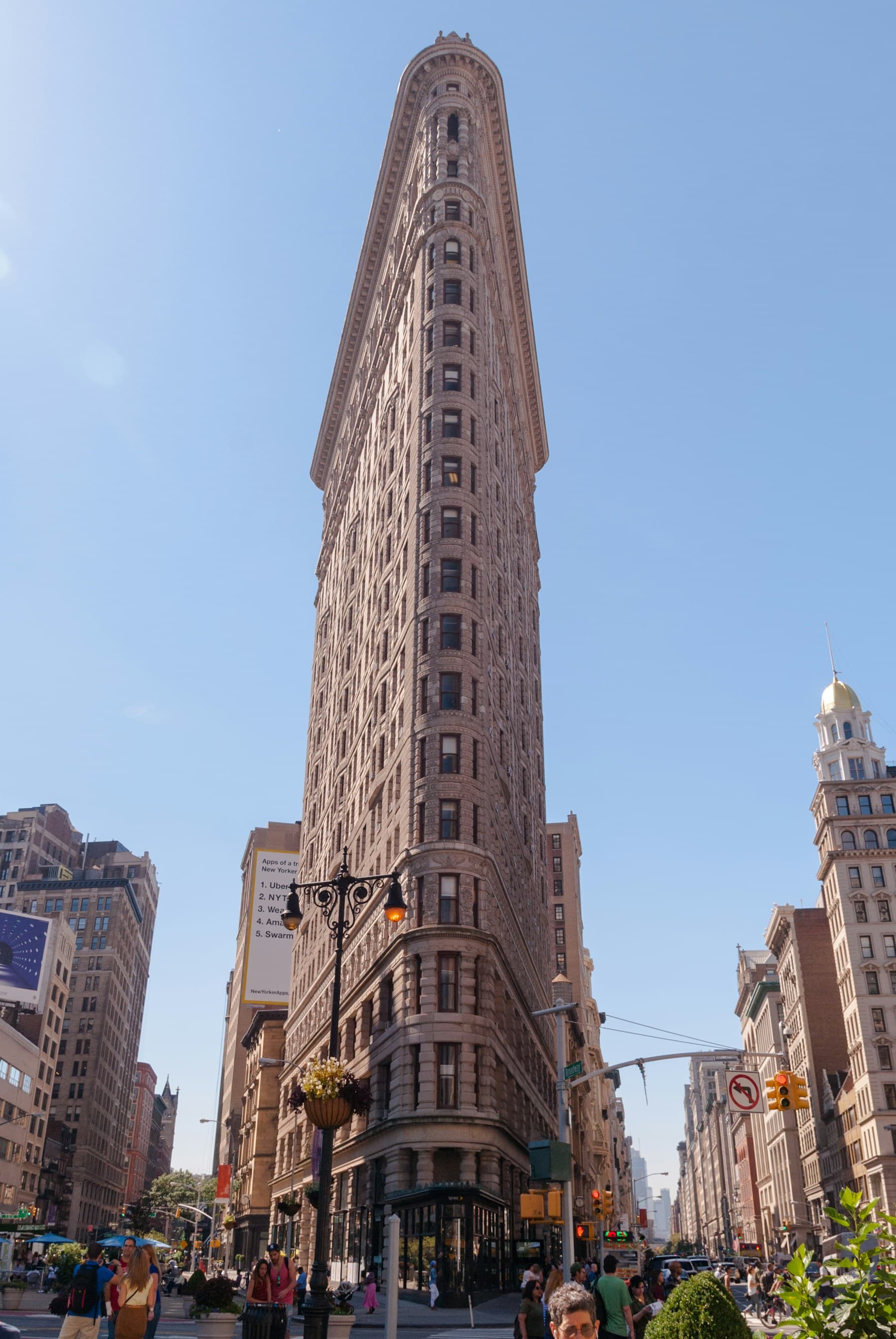 New York’s Flatiron Building rising above a Manhattan street